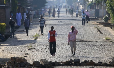 People walk in a street in Bujumbura.