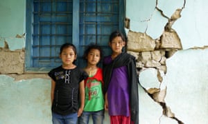 Girls in front of their closed primary school in Makwanpur District, one of Plan's response areas 
