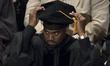 Kanye West adjusts his cap before at the ceremony to receive his honorary doctorate from the Art Institute of Chicago