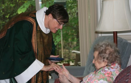 Sr Miriam Elizabeth, OSH giving communion to Sr Ruth, OSH 