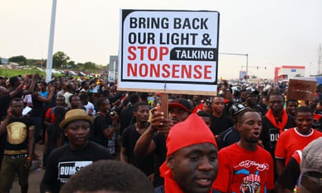 People protest against power cuts during a demonstration in Accra.