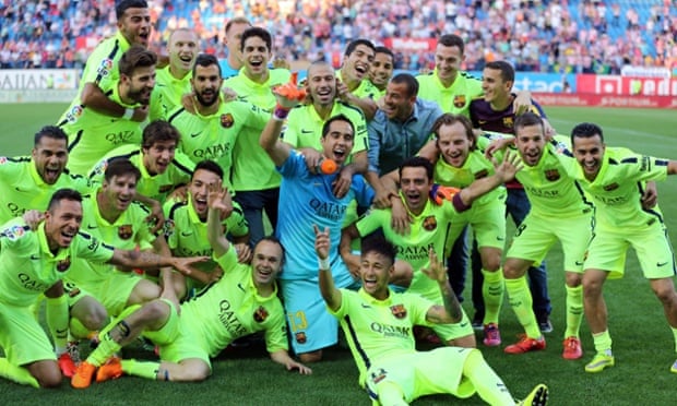 Barcelona's players celebrate winning La Liga after the 1-0 victory at Atlético Madrid.