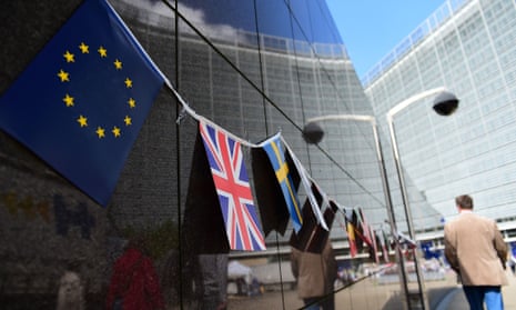 An European flag and a British flag stand next to each others outside the European Commission building, in Brussels, on May 8 2015