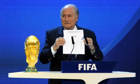 FILE - In this Dec. 2, 2010 file picture FIFA President Joseph S. Blatter announces that Qatar will be hosting the 2022 Soccer World Cup, during the FIFA  2018 and 2022 World Cup Bid Announcement in Zurich, Switzerland. A FIFA task force on Tuesday, Feb. 24, 2015 recommended playing the 2022 World Cup in November-December to avoid the summer heat in Qatar. The plan must be approved by the FIFA executive committee, chaired by Blatter, at a March 19-20, 2015 meeting in Zurich. (AP Photo/Keystone/Walter Bieri, File)