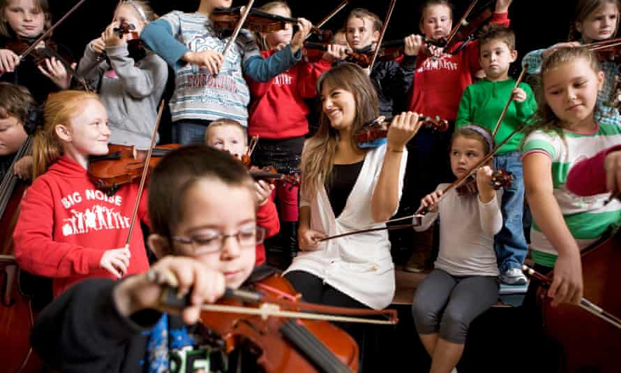 Scottish violinist Nicola Benedetti at Raploch Community Campus with children from Raploch's Big Noise orchestra.