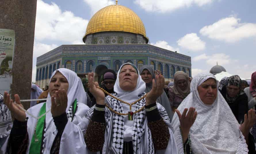 Palestinian women take part in Friday prayers during  Ramadan at Al-Aqsa mosque compound in Jerusalem.