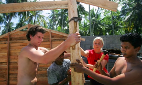 A team of foreign volunteers and Sri Lankan workers put up a transitional house for a Tsunami affected family in 2005.