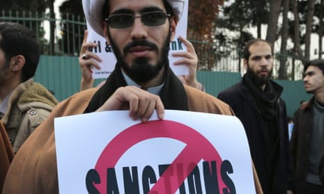 An Iranian protests against sanctions, Tehran, November, 2014  AFP PHOTO/ATTA KENAREATTA KENARE/AFP/Getty Images