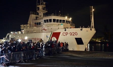 Italian coastguard ship Bruno Gregoretti, carrying survivors of the boat that overturned off the coast of Libya, arrives at Catania on 20 April.