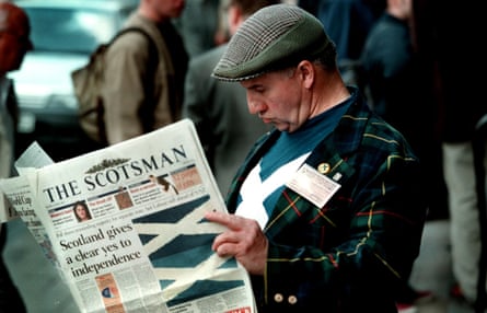 An SNP delegate reads the Scotsman on his way in to SNP special conference in Perth in 1998.