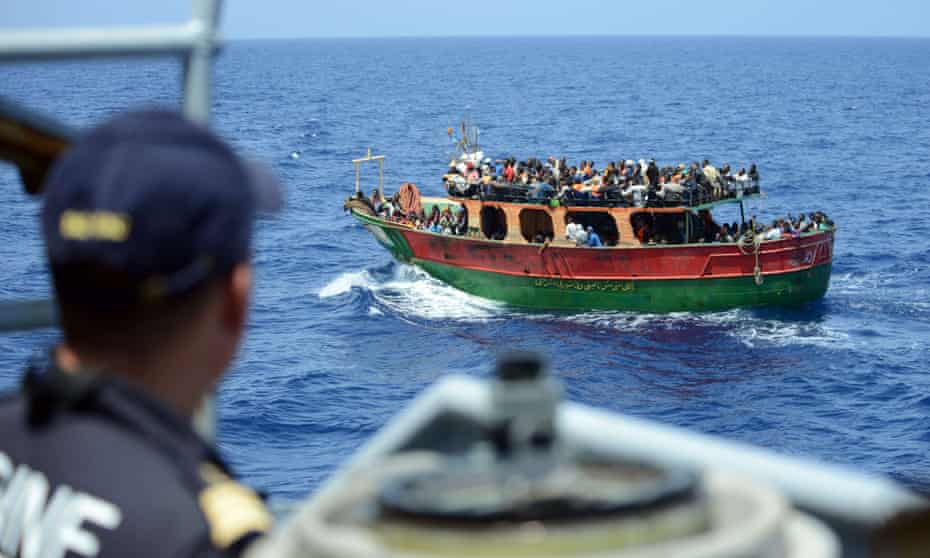 A French navy ship rescuing 297 migrants aboard a fishing boat in the Mediterranean earlier this week.