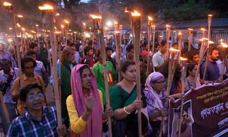 A torchlit protest against the killing of blogger Ananta Bijoy Das in Dhaka