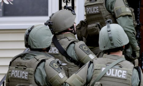 A Swat team enters a house in Boston.