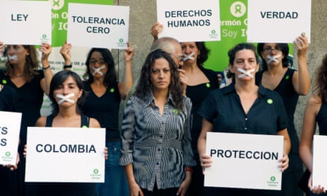 Colombian journalist Jineth Bedoya Lima (centre) takes part in a silent rally in Madrid.
