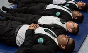 Teachers and pupils practice meditation techniques at Bethnal Green Academy