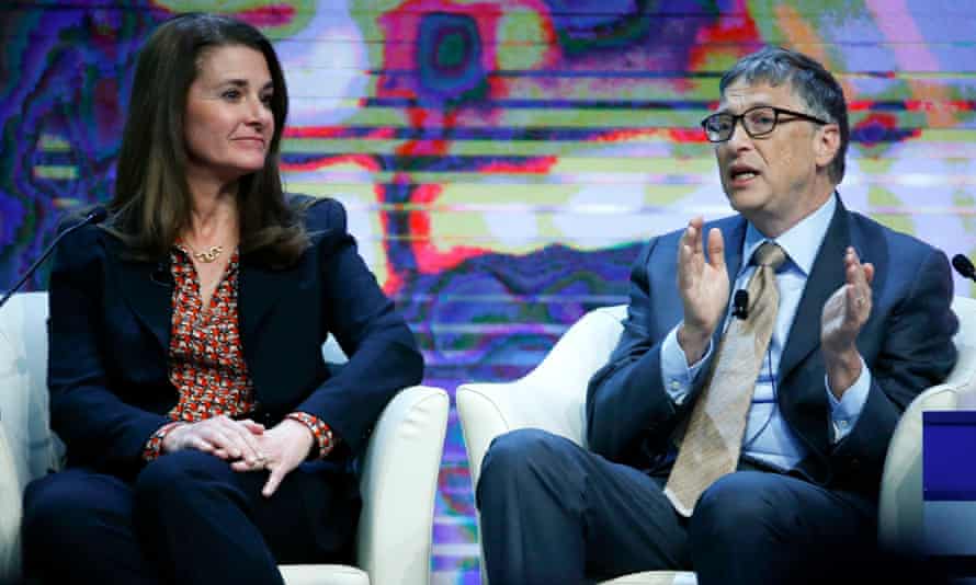 Bill Gates, Co-Chair of the Bill & Melinda Gates Foundation gestures next to his wife Melinda French Gates during the session 'Sustainable Development: A Vision for the Future' in the Swiss mountain resort of Davos January 23, 2015. More than 1,500 business leaders and 40 heads of state or government attend the Jan. 21-24 meeting of the World Economic Forum (WEF) to network and discuss big themes, from the price of oil to the future of the Internet.