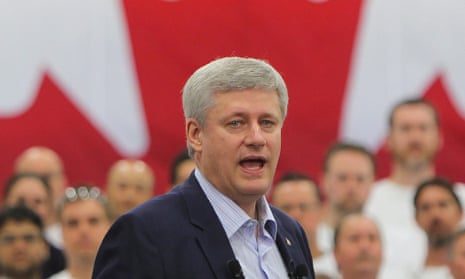 Prime Minister Stephen Harper addresses a crowd as he highlighted a manufacturers ten-year-tax incentive at a news conference in Windsor,  on Thursday, May 14, 2015.  Manufacturers will be able to write off equipment more quickly under proposed tax rule changes.  (Dave Chidley/The Canadian Press via AP) MANDATORY CREDIT
