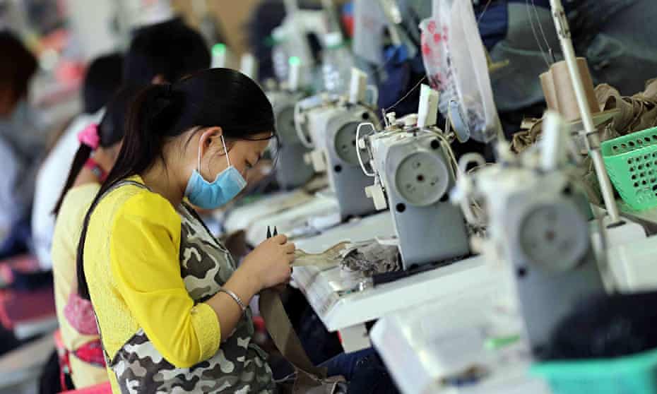 Workers making jeans in China