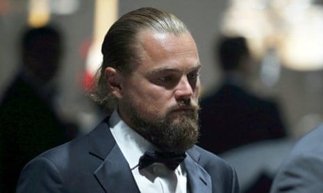 Leonardo DiCaprio walks during an auction at amfAR's Cinema Against AIDS 2015.