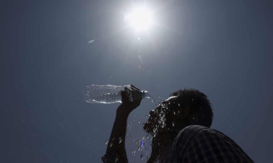 A man pours water on his face in Hyderabad, India, on Sunday.