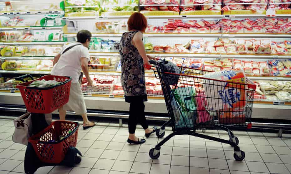 People shop in a supermarket in southern France.