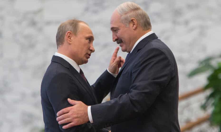Belarus's president Alexander Lukashenko, right, greets his Russian counterpart Vladimir Putin during a leaders' summit in 2014.