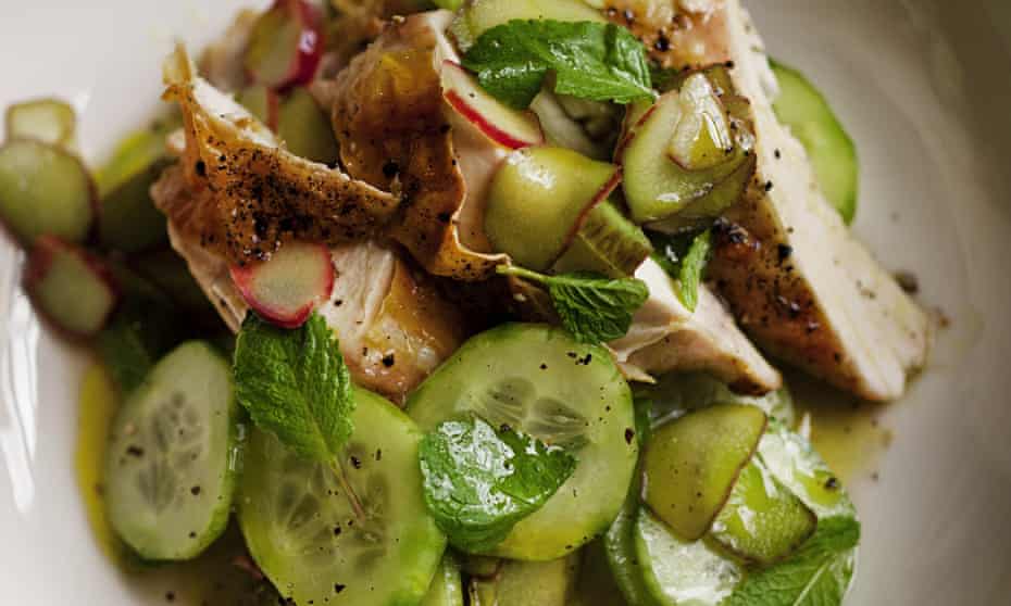 Salad of roast chicken, rhubarb and cucumber on a plate
