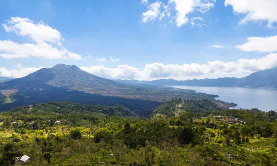07 May 2013, Bali, Indonesia --- Indonesia, View of volcanic mount Batur with volcanic lake --- Image by Martin Moxter/Westend61/CorbisAsiaBaliBangli Regencybeautybeauty in naturecloudscratercrater lakeIndonesiaislandlandscapelightlushMalay ArchipelagoMount BaturmountainnobodyNusa TenggaraoutdoorsscenicserenityskySoutheast AsiaSunda Islandssunshinetravelvolcanic featurevolcanic landscapevolcanowaters