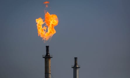 A flare burns over the ExxonMobil's refinery in Los Angeles, California.