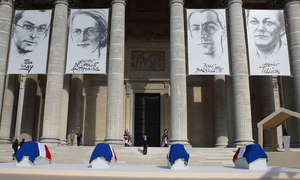 Francois Hollande (centre) stands on the Pantheon steps between the flag-draped coffins of Jean Zay, Genevieve de Gaulle-Anthonioz, Pierre Brossolette and Germaine Tillion.