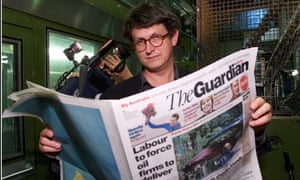 Rusbridger with the first edition of the Guardian North printed at Trafford Park Printers.