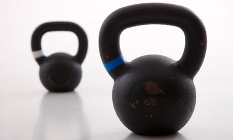 Kettlebells weights in a workout gym. Pure Gym is buying LA Fitness.