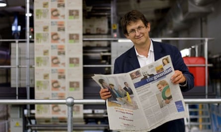 Rusbridger with the first copy of the new Berliner-format Guardian in September 2005.