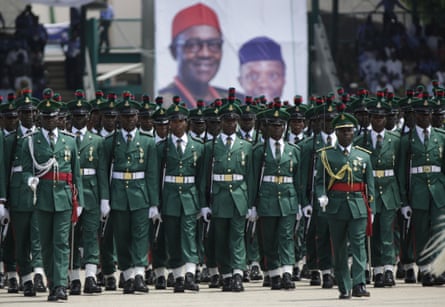 Soldiers parade in the green and white of Nigeria at Muhammadu Buhari's inauguration.