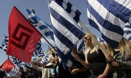 Golden Dawn supporters hold the party flag and Greek national flags during a rally in Athens last year. The neo-Nazi party is Greece’s third biggest political force, and has accused Tsipras of submitting to Merkel. 