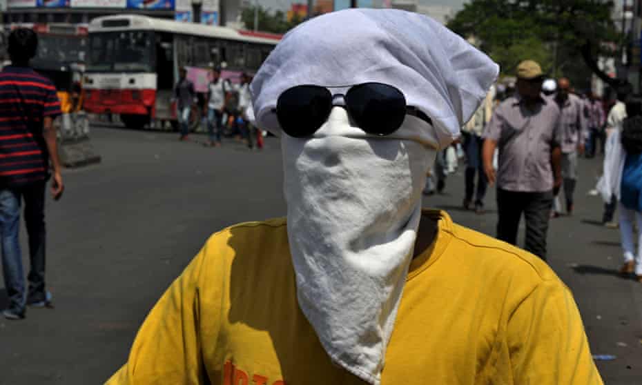 A man covers his head in Hyderabad