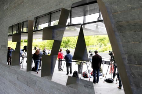 Members of the media stand in front of the Fifa headquarters in Zurich on Saturday.