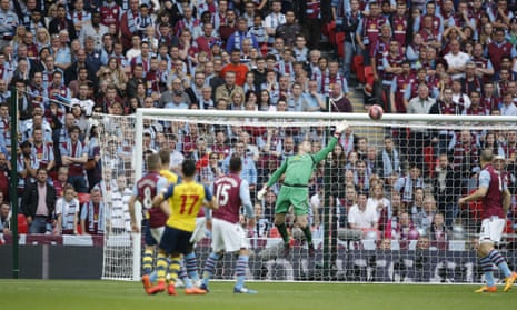 The ball swerves through the air and past Given to Arsenal's lead is doubled.