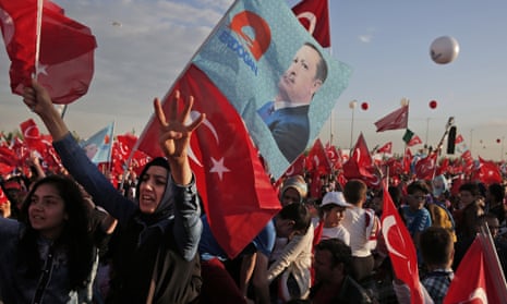 Supporters of Recep Tayyip Erdogan wave flags