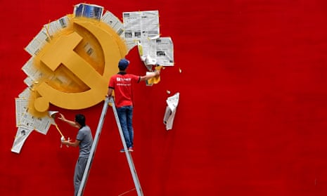 Workers repaint the Chinese Communist party flag in Jiaxing