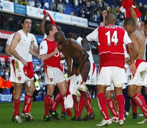 2003-04 Patrick Vieira strips down to his pants as the Arsenal players celebrate winning the title after a 2-2 draw against Tottenham at White Hart Lane. The Gunners went through the season without a single defeat – the first team ever to do so in a 38 game league season - and became known as the Invincibles. Their record during the season was won 26 drew 12 lost 0 and they topped the table with 90 points,  11 points above second placed Chelsea
