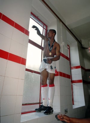1997-98 Ian Wright opens the dressing room window to speak to the fans outside after their 4-0 victory over Everton at Highbury gave Arsenal their first title in seven years.  It was Arsene Wenger's first full season in charge and the victory meant he was the first manager from outside the British Isles to win the league title.  The Gunners went on to beat Newcastle United 2–0 to clinch the FA Cup and win Arsenal's second double