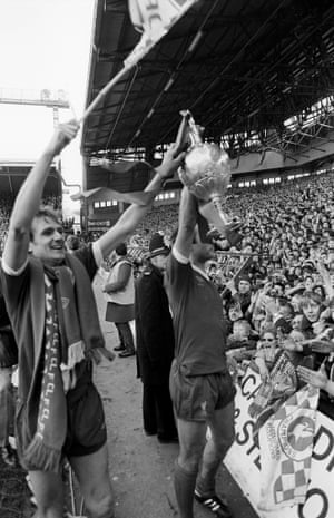 1979-80 Phil Thompson and Ray Kennedy show the  the First Division Championship trophy to the Kop following their 4-1 win over Aston Villa.  Liverpool retained the title after fighting off a determined challenge by Manchester United