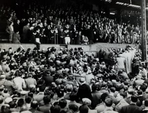 1954-55 Chelsea captain Roy Bentley at the microphone, as an excited crowd of 51,42 inside Stamford Bridge salute the team that had clinched the League Championship for the first time in the club's history following their 3-0 win over Sheffield Wednesday