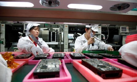 Employees work on the assembly line at the Foxconn plant in Shenzhen, China.