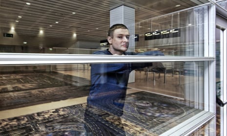 Simon Denny with his installation titled Secret Power at Marco Polo Airport, as part of Venice Biennale 2015