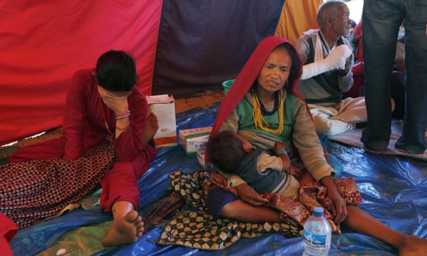 People injured in last month's earthquake rest inside a tent at a makeshift hospital in Chautara, Sindhupalchok district, Nepal.