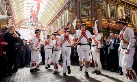 Traditional Morris Men jig in the undervover Leadenhall Market in the City of London, on England's national St George's Day the 23rd April
