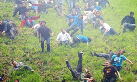 Competitors during the annual Cheese Rolling competition at Coopers Hill near Browckworth, Gloucestershire