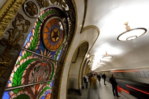 Subway passengers stand on the platfrom at the Novoslobodskaya metro station, April 2014